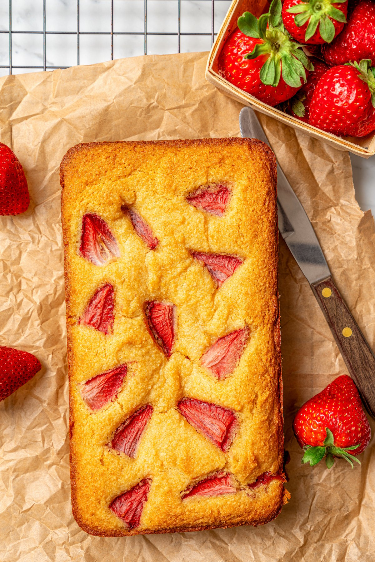 Freshly-baked strawberry bread with golden edges. 